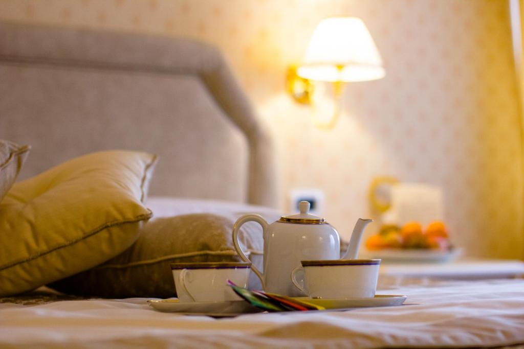 Postel nebo postele na pokoji v ubytování Hotel La Locanda