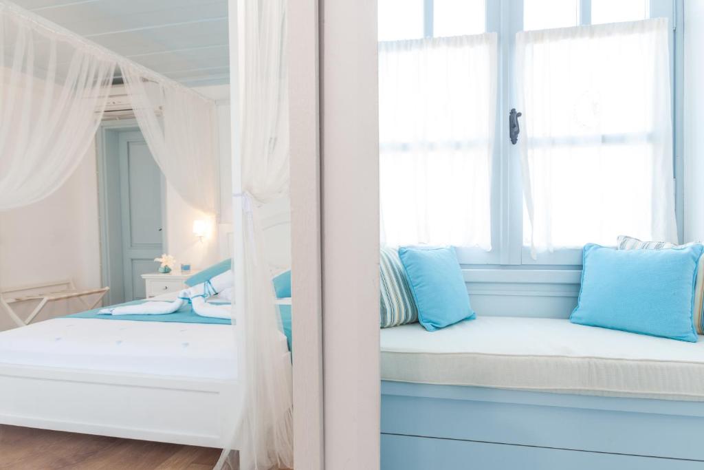 Postel nebo postele na pokoji v ubytování Alura Hotel