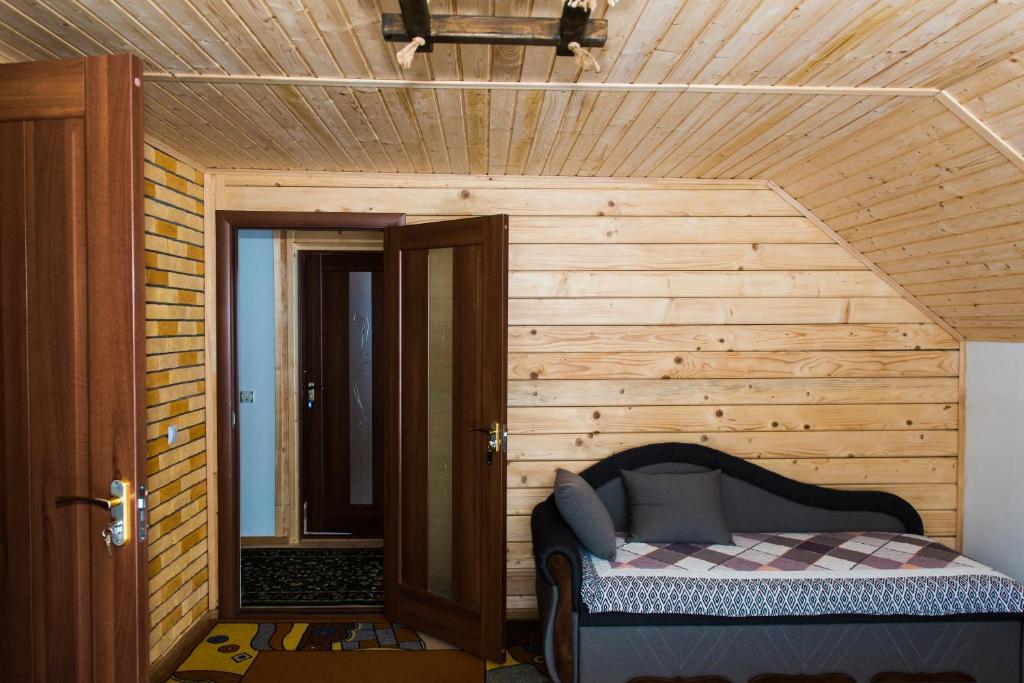 Postel nebo postele na pokoji v ubytování Шале на зарінку