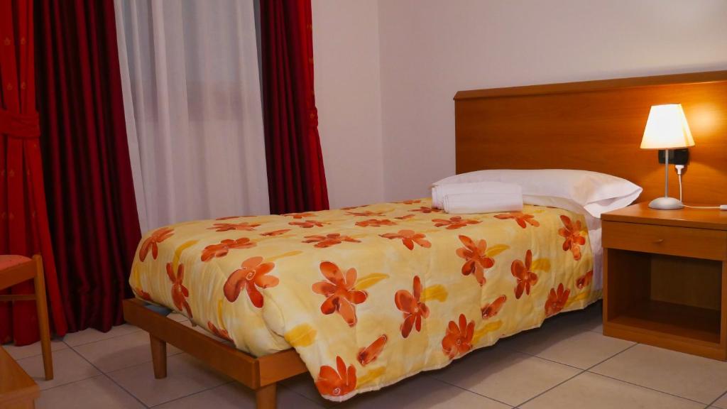 Postel nebo postele na pokoji v ubytování hotel Vajont