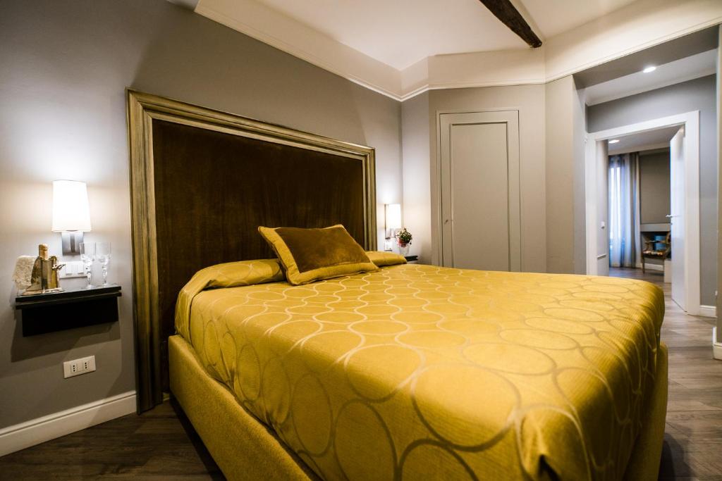 Postel nebo postele na pokoji v ubytování Hotel Antica Locanda