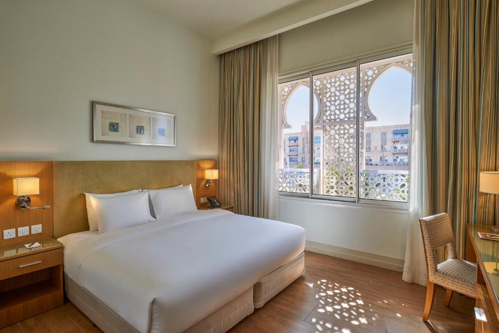 Postel nebo postele na pokoji v ubytování Salalah Gardens Hotel Managed by Safir Hotels & Resorts