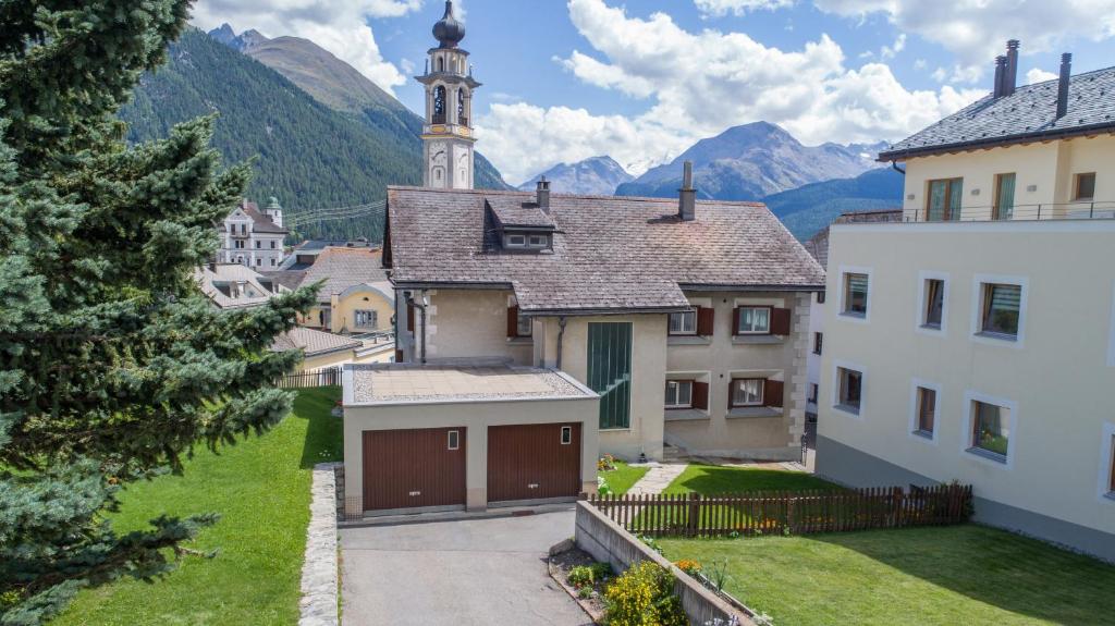 a view of a town with mountains in the background at Chesa Talvo, Samedan in Samedan