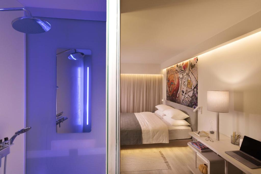 Postel nebo postele na pokoji v ubytování Link Hotel & Hub By Dan Hotels