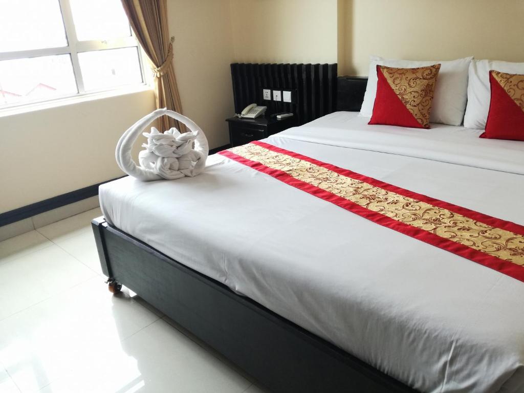 Postel nebo postele na pokoji v ubytování Salita Hotel