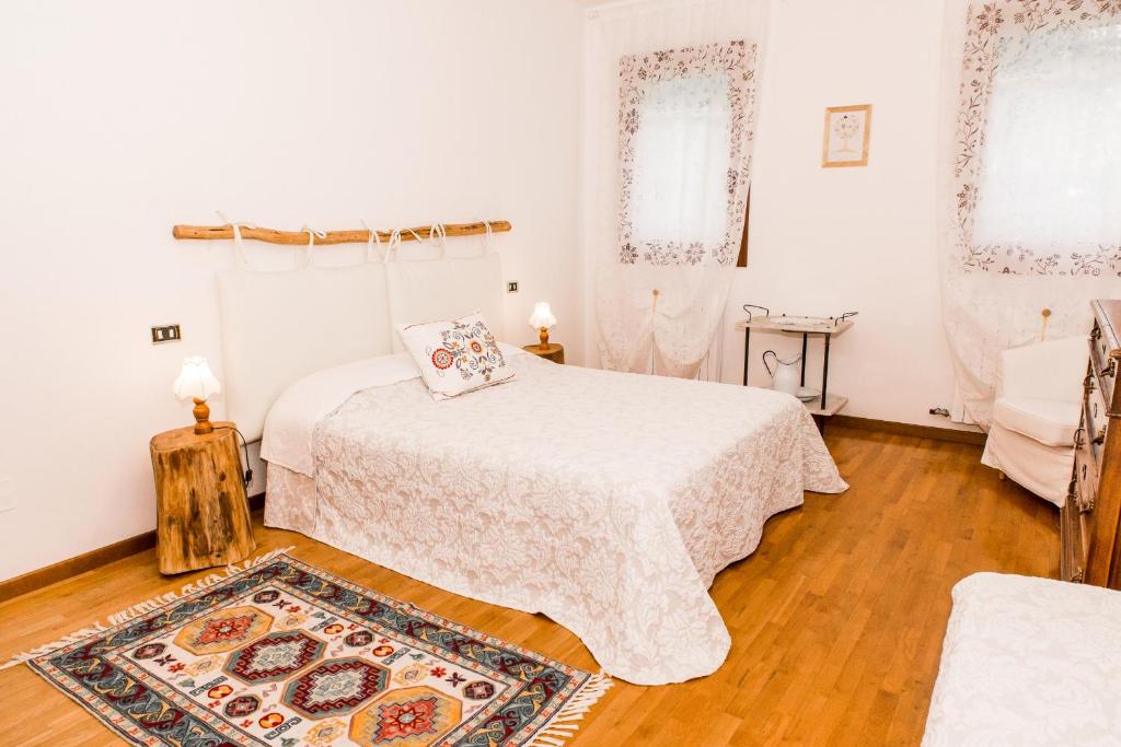 Postel nebo postele na pokoji v ubytování Agriturismo Alba