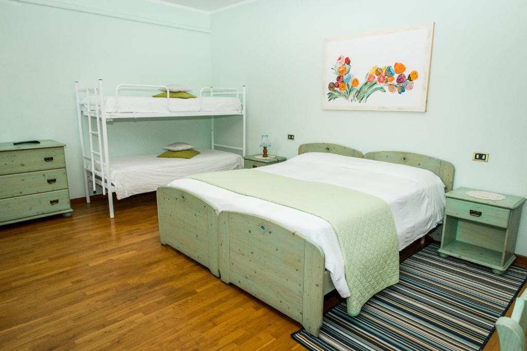 Postel nebo postele na pokoji v ubytování Agriturismo Alba