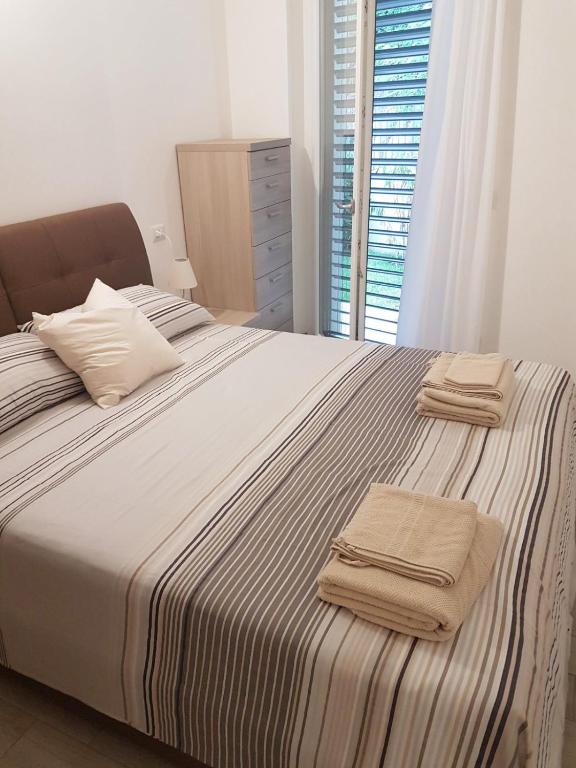Posteľ alebo postele v izbe v ubytovaní Baia Blu - Luxury Apartments with Pool