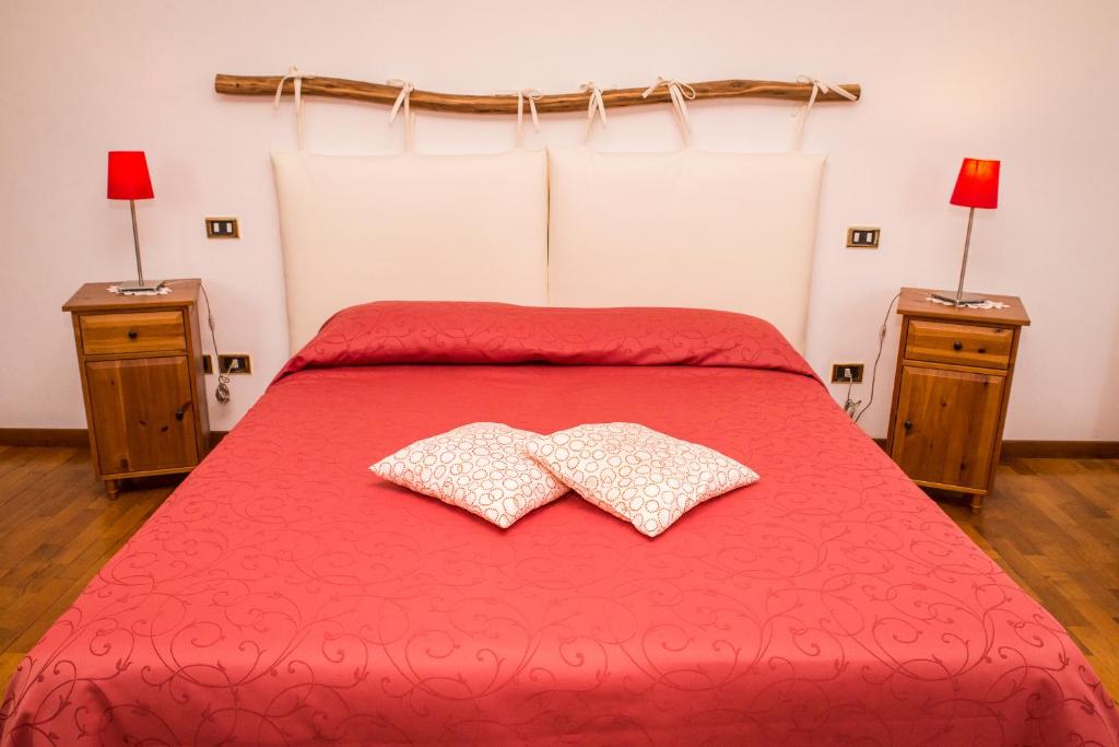 Postel nebo postele na pokoji v ubytování Agriturismo Alba