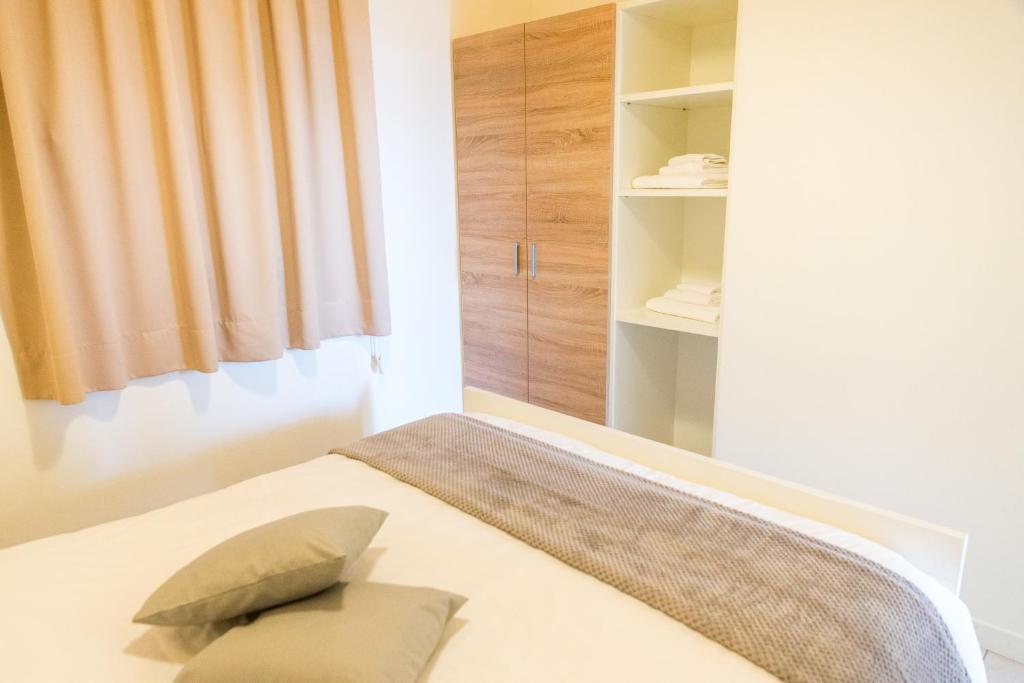 Postel nebo postele na pokoji v ubytování Agriturismo Alba