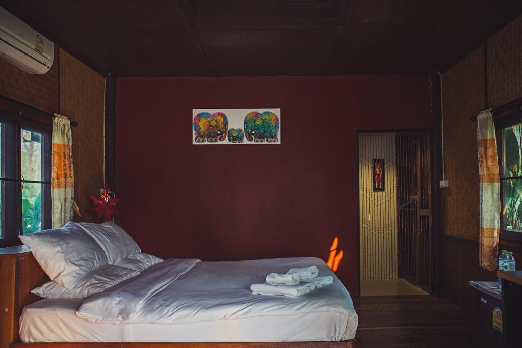 Postel nebo postele na pokoji v ubytování Kalm Pai