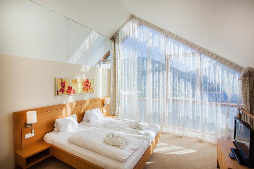 Postel nebo postele na pokoji v ubytování Hotel Hollweger
