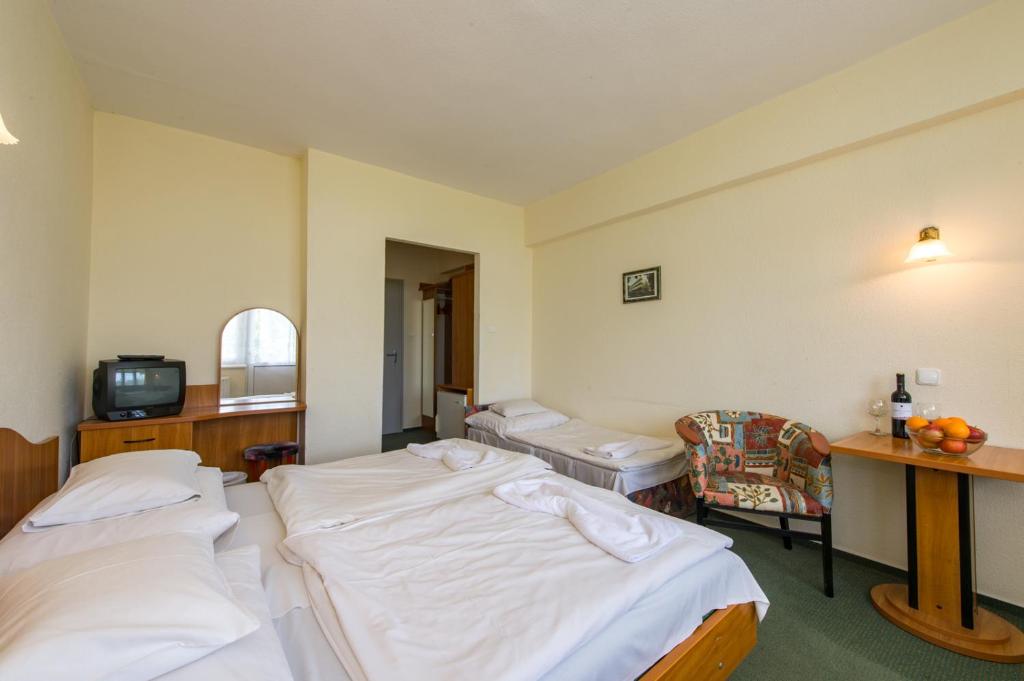Postel nebo postele na pokoji v ubytování Hotel Nostra