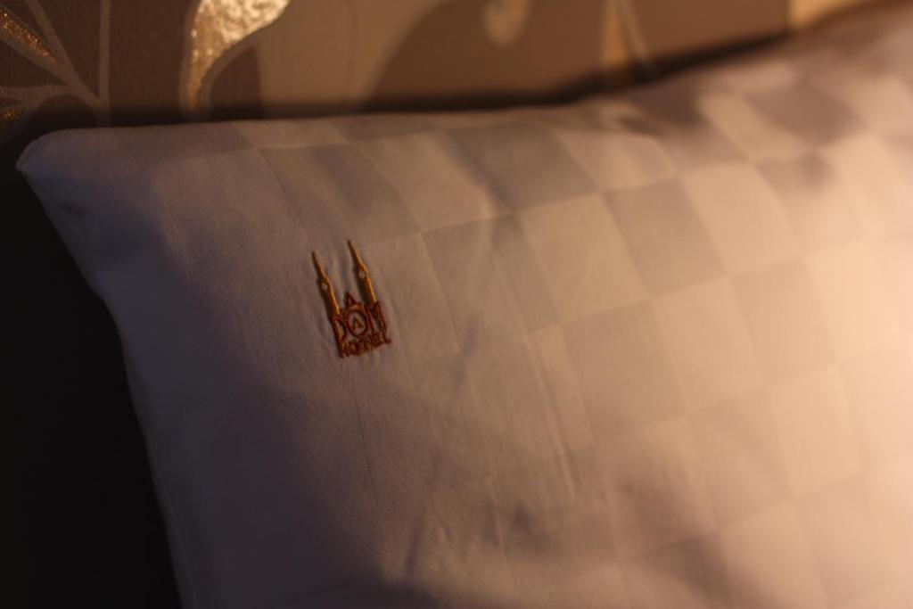 Postel nebo postele na pokoji v ubytování Dóm Hotel