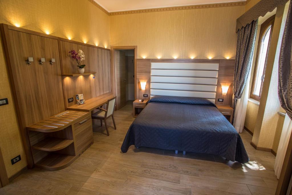 Postel nebo postele na pokoji v ubytování Hotel Vela D'oro ***S