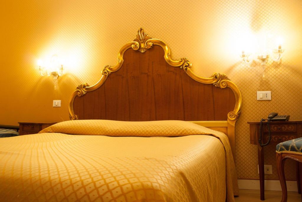Postel nebo postele na pokoji v ubytování Hotel Locanda Canal
