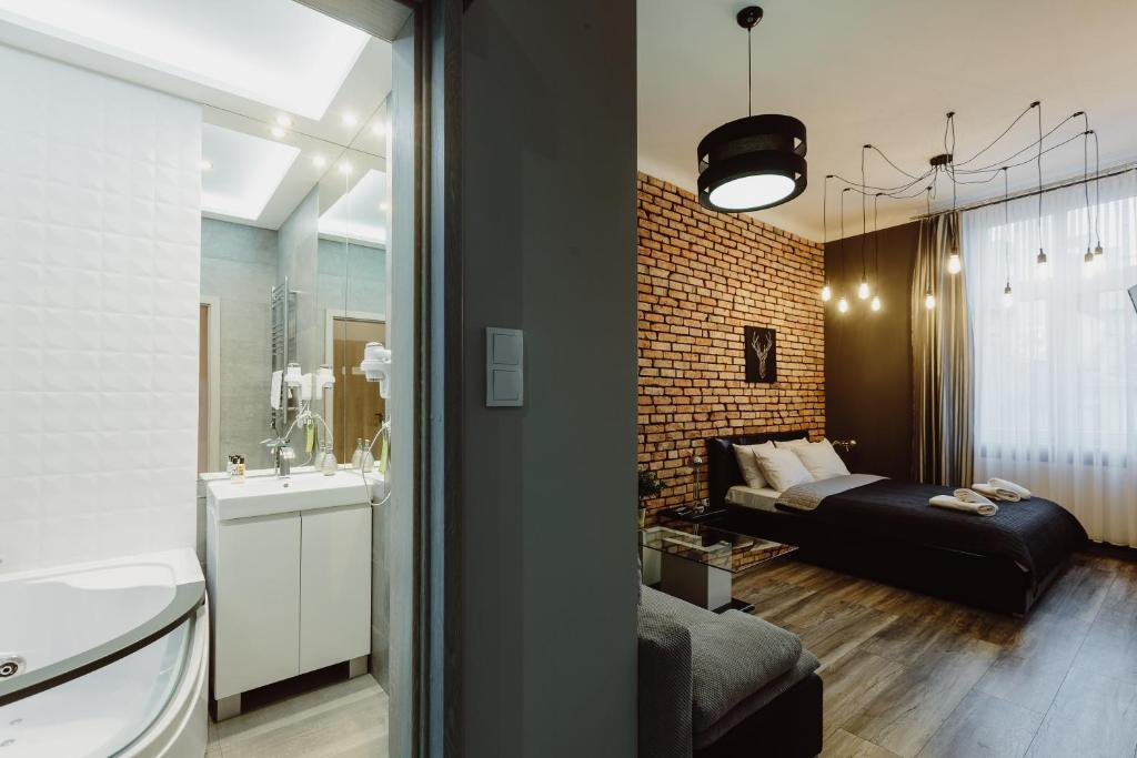 Posteľ alebo postele v izbe v ubytovaní Leo Apartments Main Square