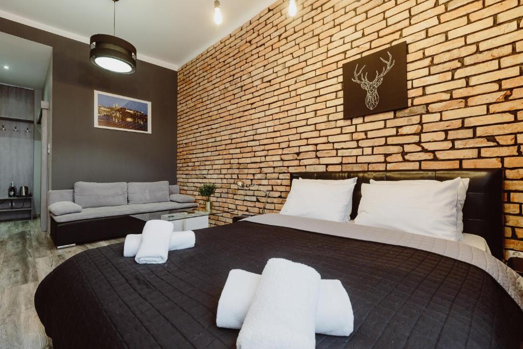 Posteľ alebo postele v izbe v ubytovaní Leo Apartments Main Square