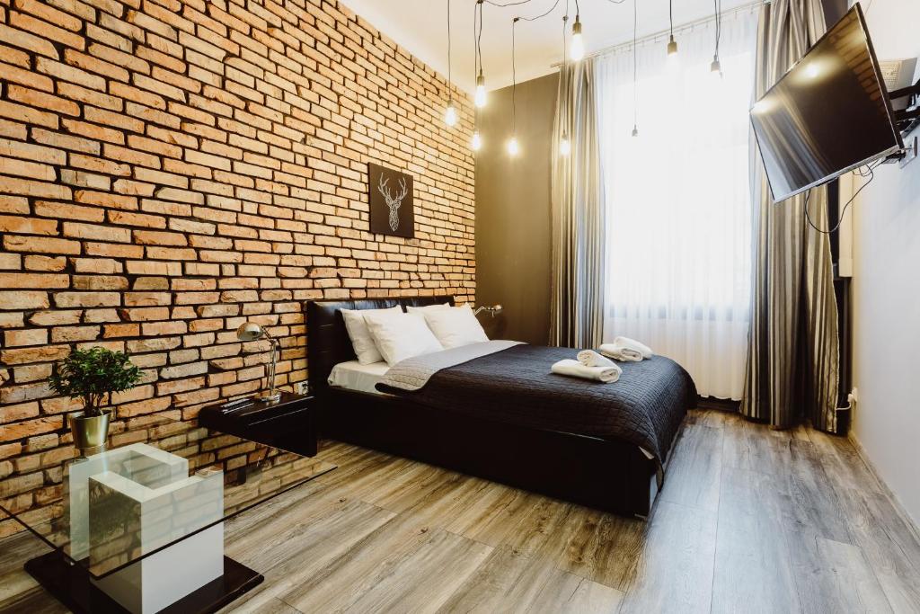 Posteľ alebo postele v izbe v ubytovaní Leo Apartments Main Square