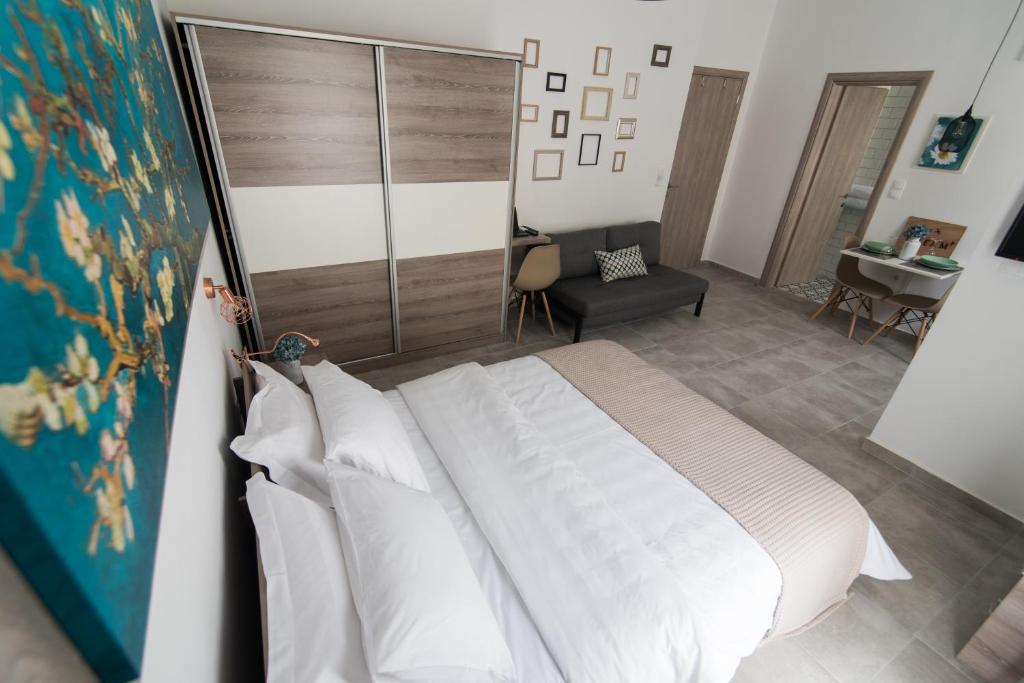 Posteľ alebo postele v izbe v ubytovaní Olive House Apartments