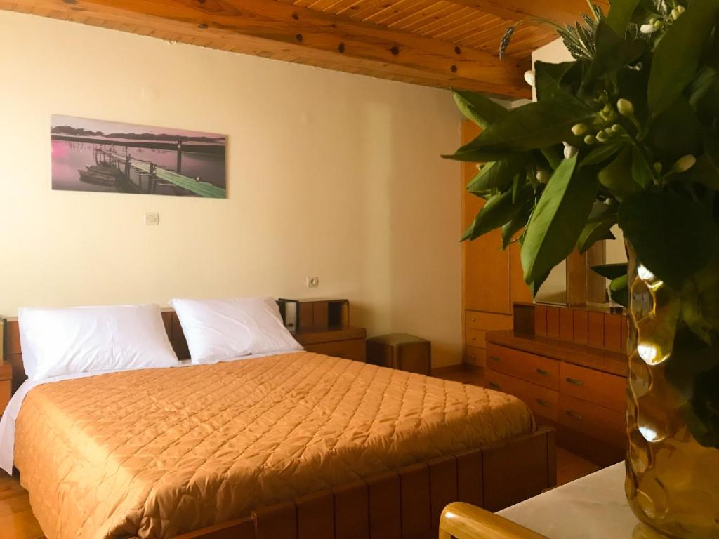 A bed or beds in a room at Antonia’s Home Alfa Village