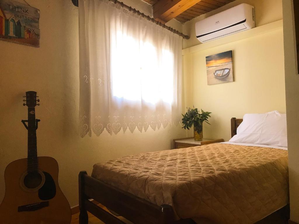 A bed or beds in a room at Antonia’s Home Alfa Village