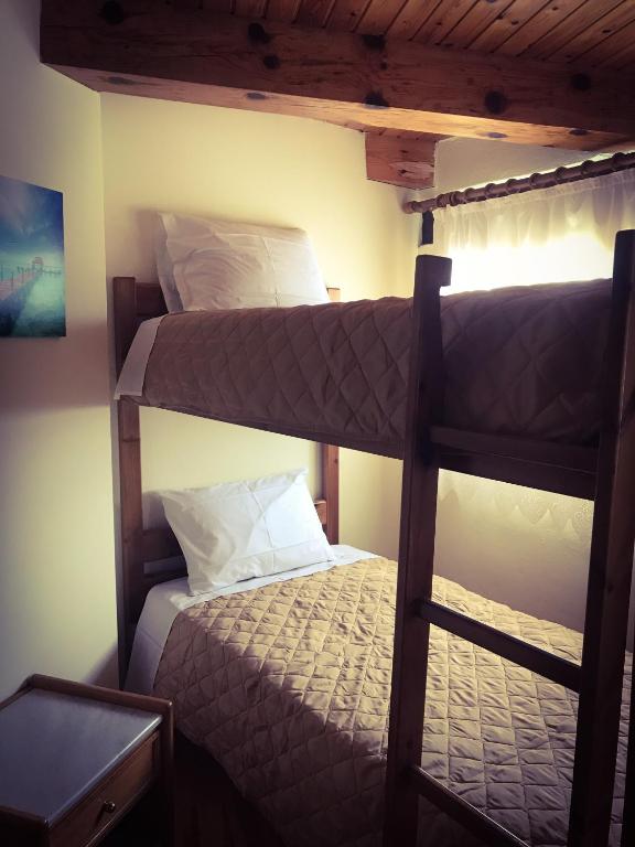 A bed or beds in a room at Antonia’s Home Alfa Village