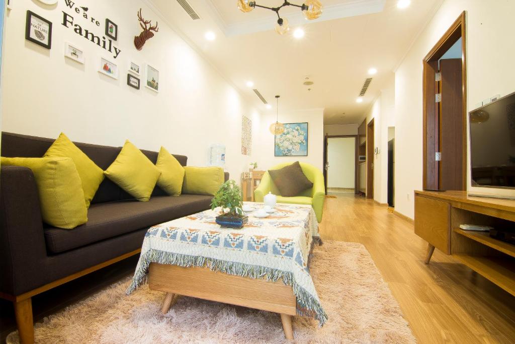 a living room with a couch and a table at Park Hill No1 Apartment in Hanoi
