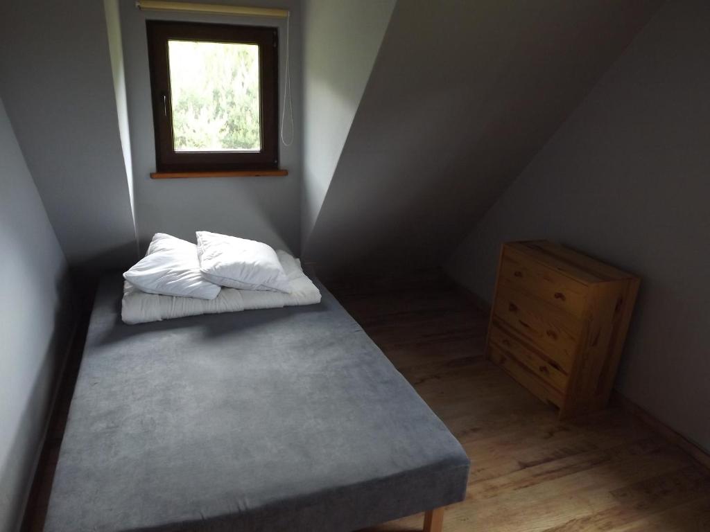 Postel nebo postele na pokoji v ubytování Domek Sabrinka