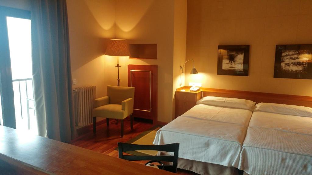 Postel nebo postele na pokoji v ubytování Parador de Vielha