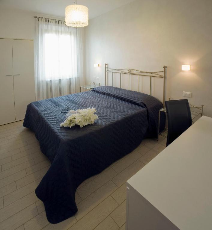 Postel nebo postele na pokoji v ubytování La Perla Del Conero Affittacamere