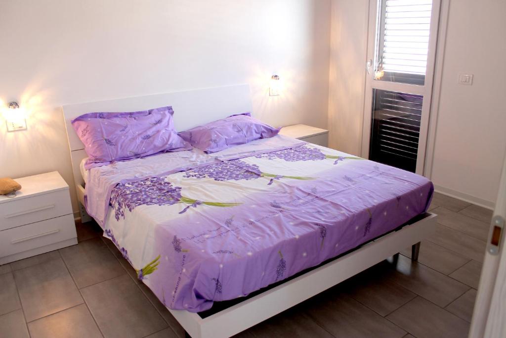 Postel nebo postele na pokoji v ubytování Casa azzurra