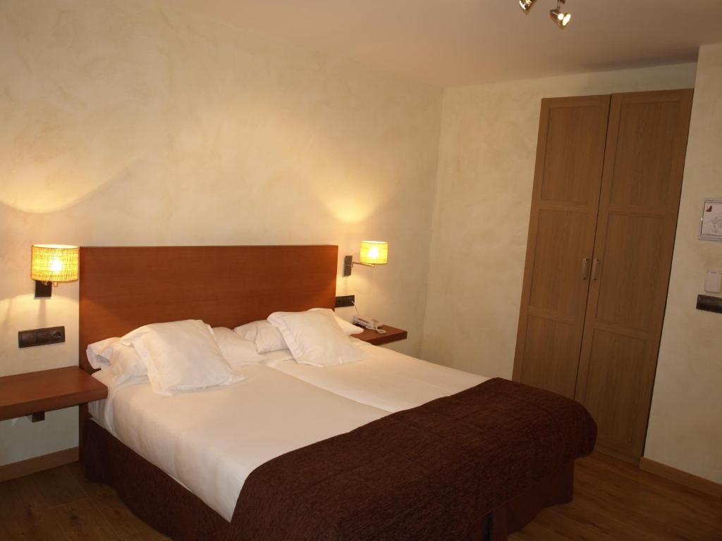 Postel nebo postele na pokoji v ubytování Hotel Las Leyendas