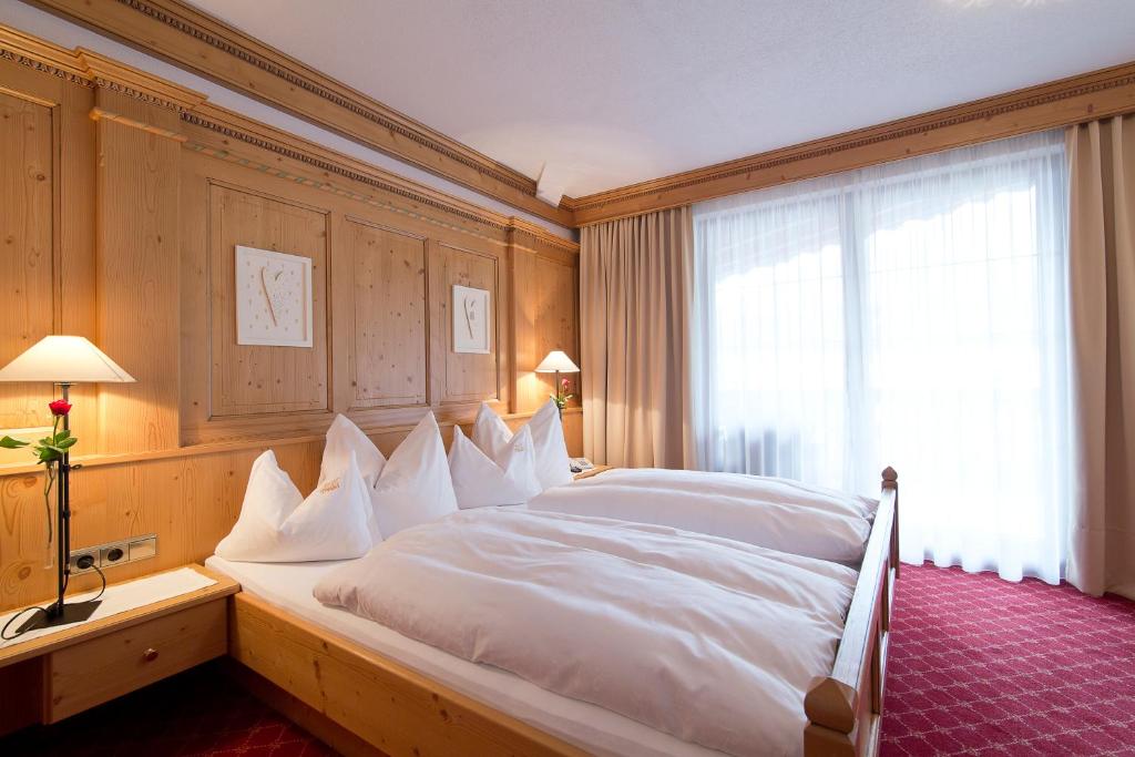 Postel nebo postele na pokoji v ubytování Hotel Englhof