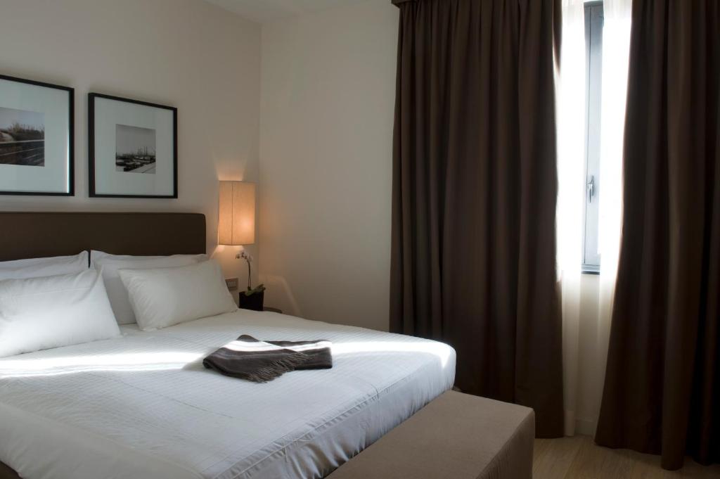 Postel nebo postele na pokoji v ubytování Marina Place Resort