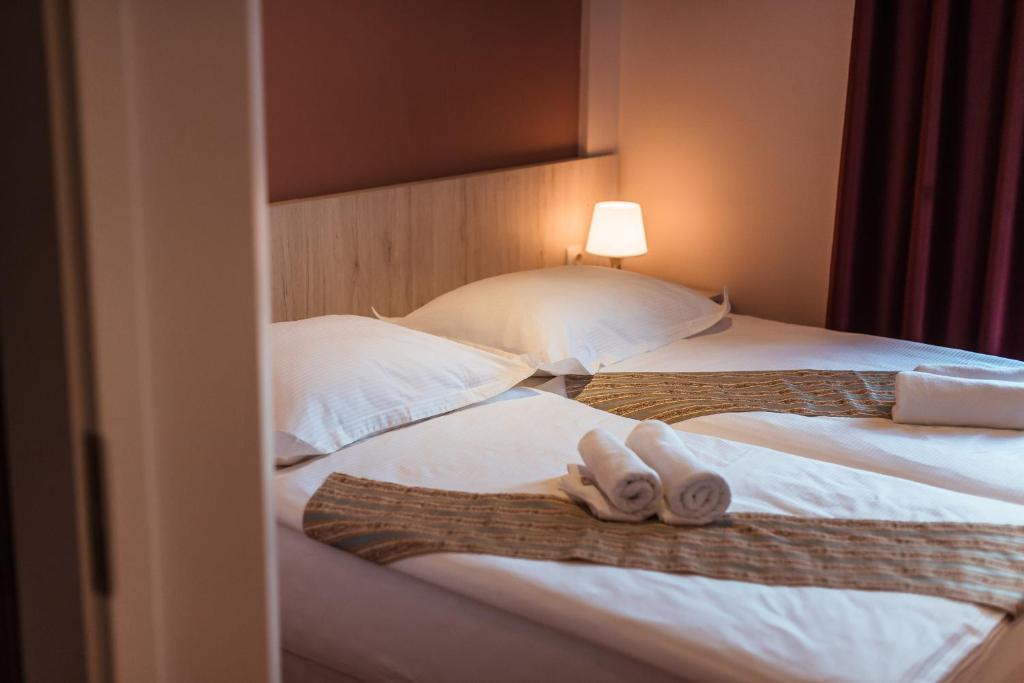 Postel nebo postele na pokoji v ubytování Boutique Hostel Livia
