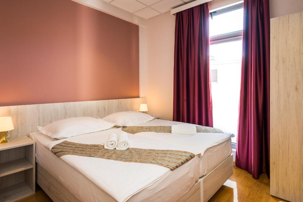 Postel nebo postele na pokoji v ubytování Boutique Hostel Livia
