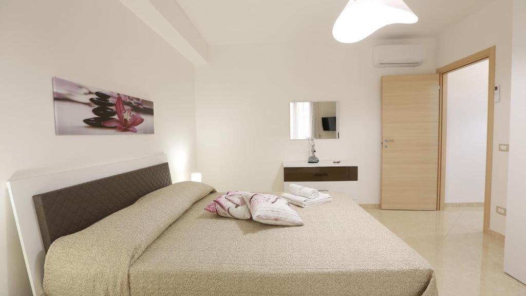 Posteľ alebo postele v izbe v ubytovaní Casa Vacanza Il Dromone