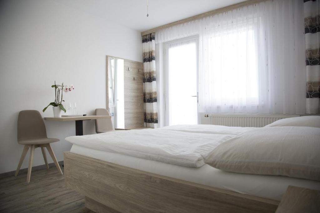 Postel nebo postele na pokoji v ubytování Gästehaus Pusztablick