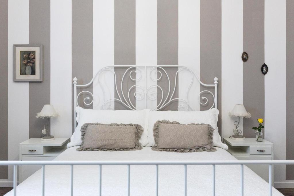 Postel nebo postele na pokoji v ubytování B&B Arco Di Pietra