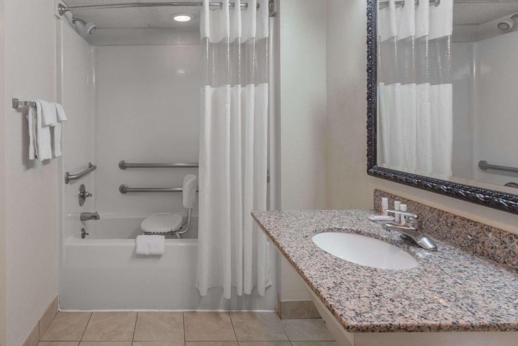 a bathroom with a sink and a shower at Baymont by Wyndham Pigeon Forge near Island Drive in Pigeon Forge