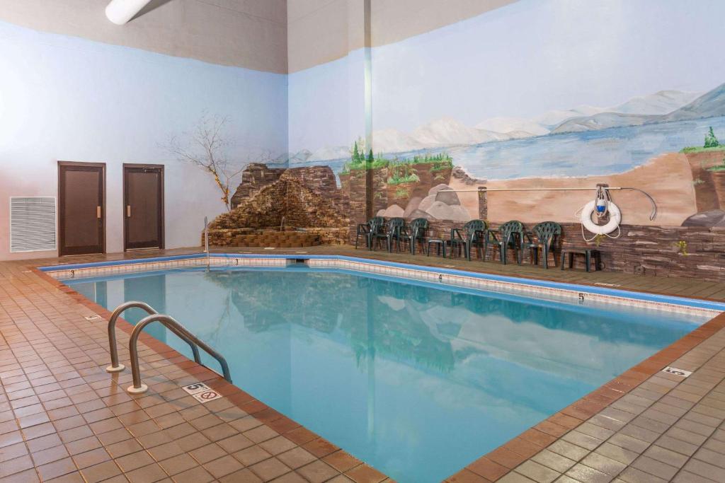 a large swimming pool in a hotel room at Baymont by Wyndham Pigeon Forge near Island Drive in Pigeon Forge