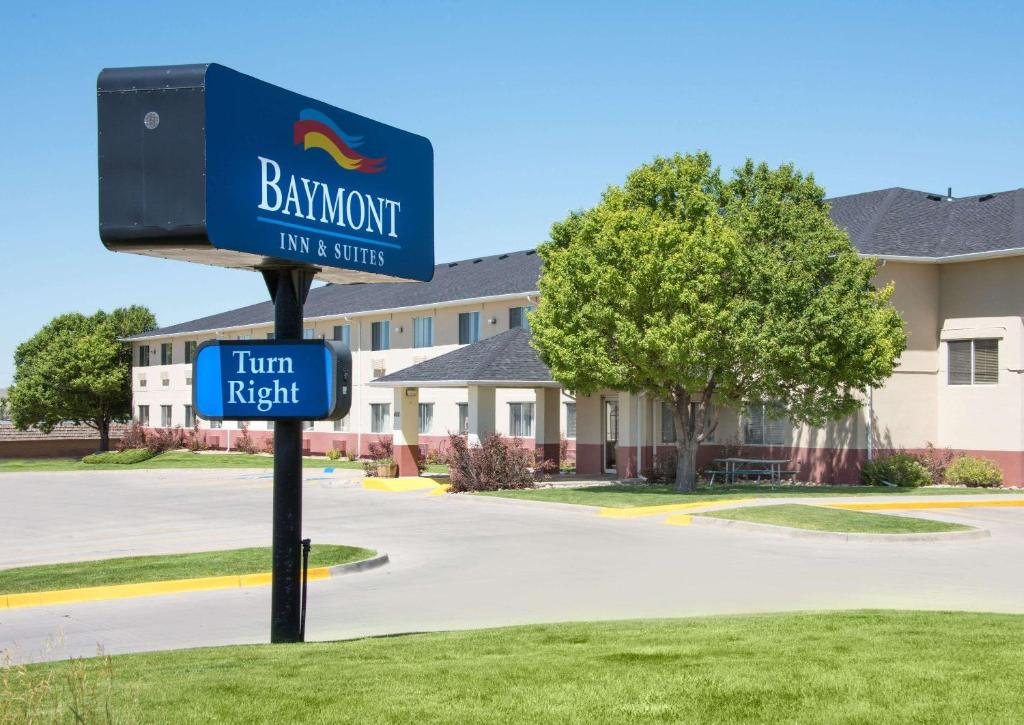 a sign for a hotel in front of a street at Baymont by Wyndham Casper East in Evansville