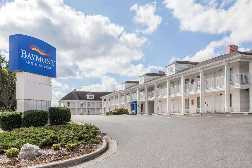 a building with a sign in front of it at Baymont by Wyndham Hickory in Hickory
