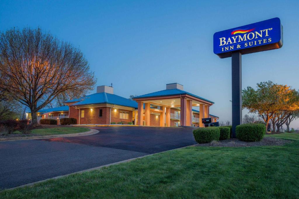 a building with a sign in front of a building at Baymont by Wyndham Warrenton in Warrenton