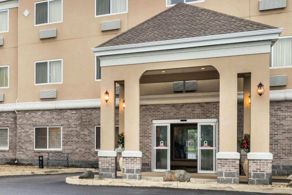 a building with a entrance to a building at Baymont by Wyndham Indianapolis Northeast in Indianapolis