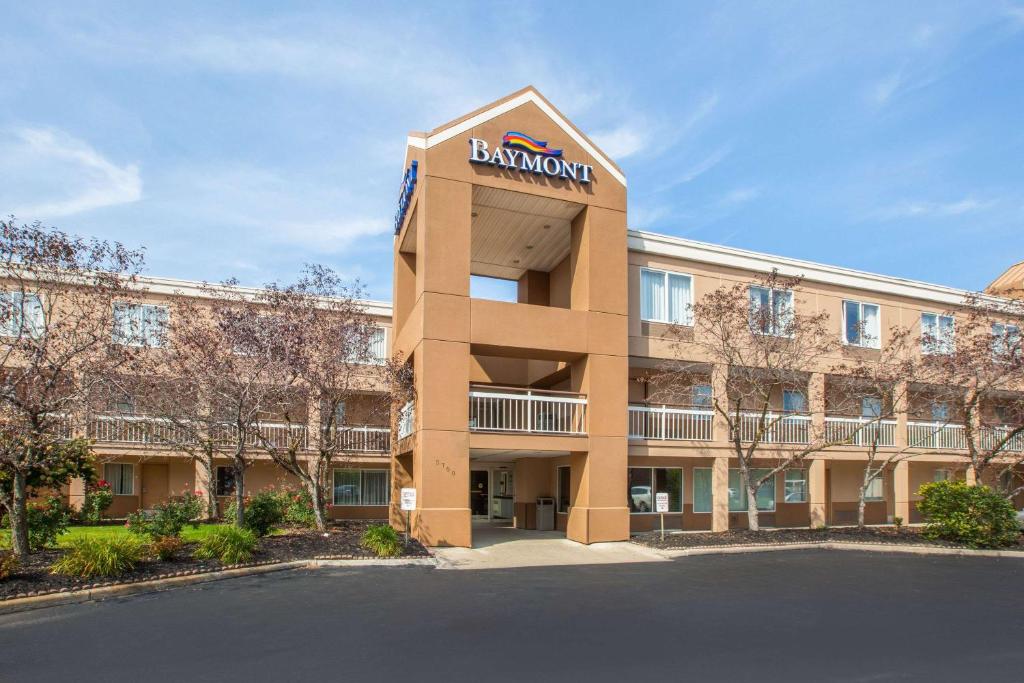 a building with a branchowment sign on top of it at Baymont by Wyndham Canton in Canton