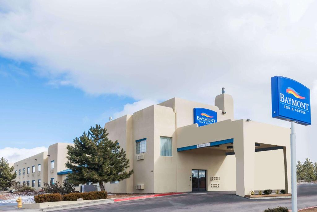 a building with a blue sign in front of it at Baymont by Wyndham Santa Fe in Santa Fe