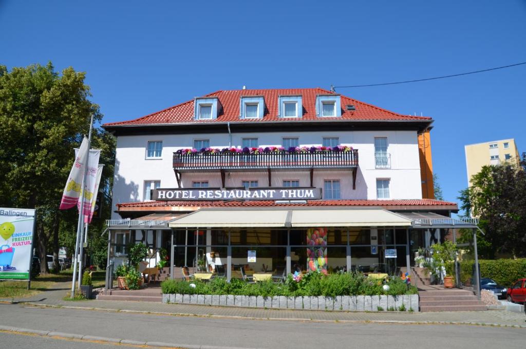 a hotel with a sign on the front of it at Hotel Restaurant Thum in Balingen