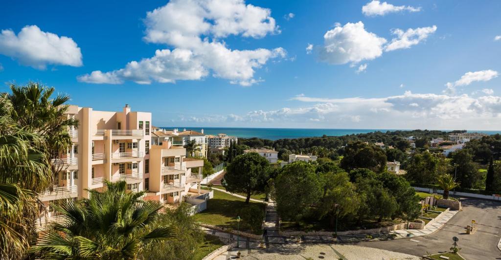 a view of a building and the ocean at Vau Seaview Apartment in Portimão